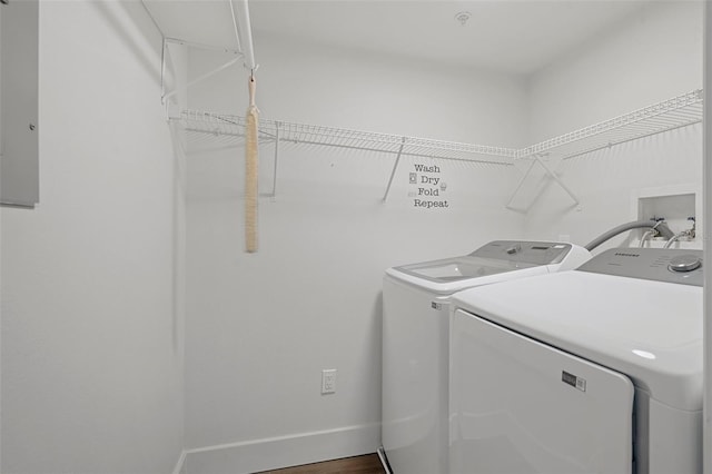 washroom with washing machine and clothes dryer