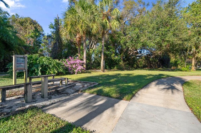 view of property's community with a yard