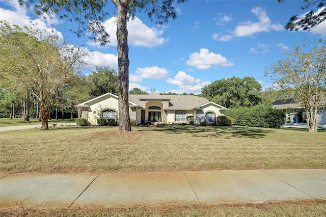 single story home featuring a front yard