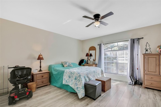 bedroom featuring ceiling fan and light wood-type flooring