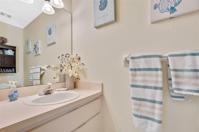 bathroom featuring vanity and vaulted ceiling