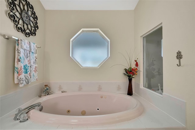 bathroom featuring a relaxing tiled tub