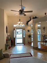 entrance foyer featuring ceiling fan