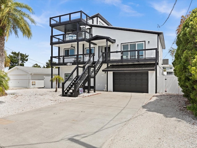 view of front of house with a balcony, covered porch, and a garage