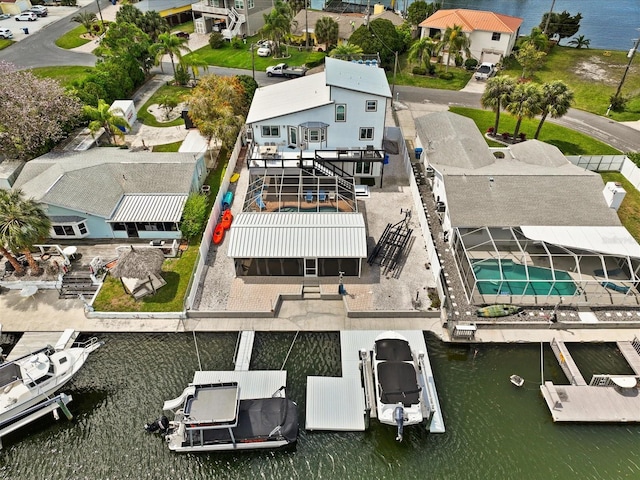 birds eye view of property with a water view