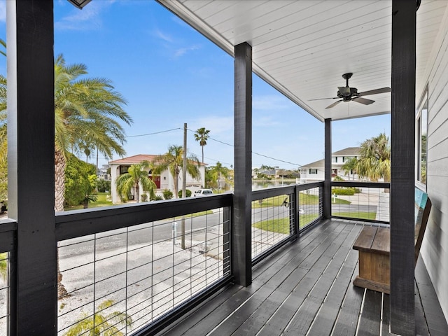 wooden terrace featuring ceiling fan