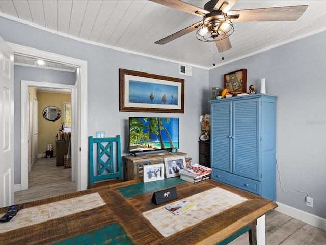 living room featuring crown molding, wood-type flooring, and wooden ceiling