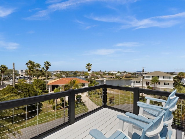 wooden terrace with a water view