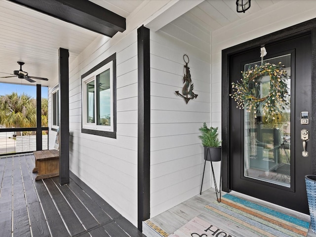 entrance to property featuring ceiling fan