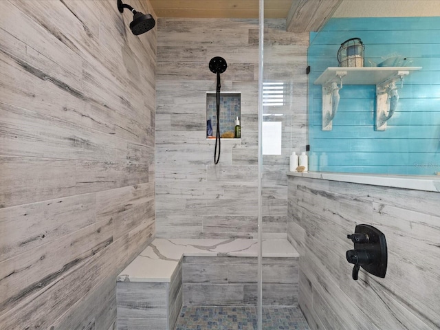 bathroom with tiled shower