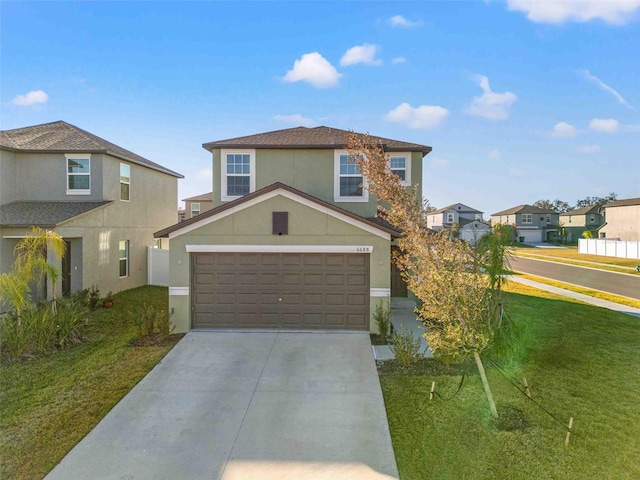 view of front of property with a garage and a front lawn