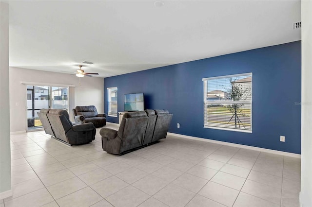 tiled living room with ceiling fan