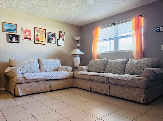 living room featuring light tile patterned floors and a textured ceiling