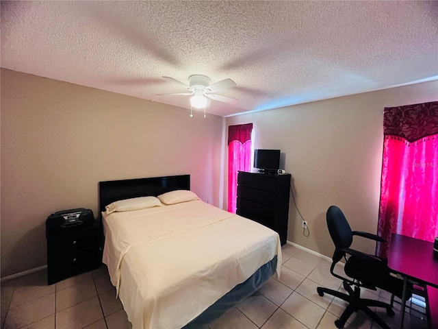 bedroom with tile patterned floors, ceiling fan, and a textured ceiling