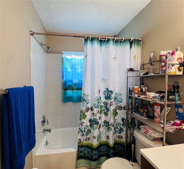 full bathroom featuring vanity, a textured ceiling, toilet, and shower / bathtub combination with curtain