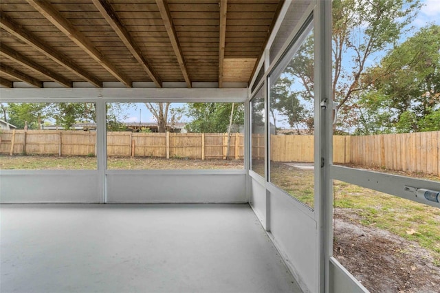 unfurnished sunroom featuring wood ceiling