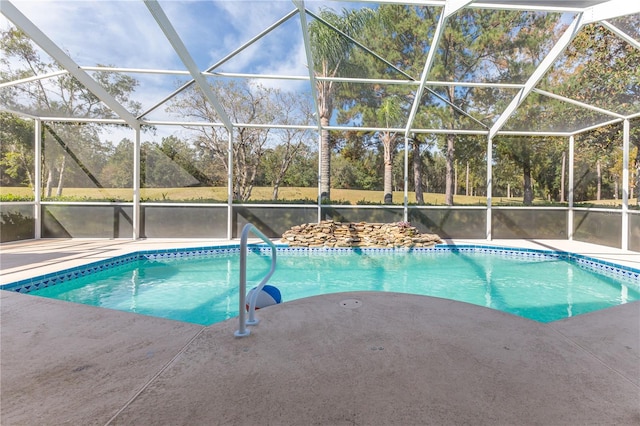 view of pool with a lanai and a patio