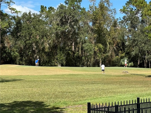 view of home's community featuring a lawn