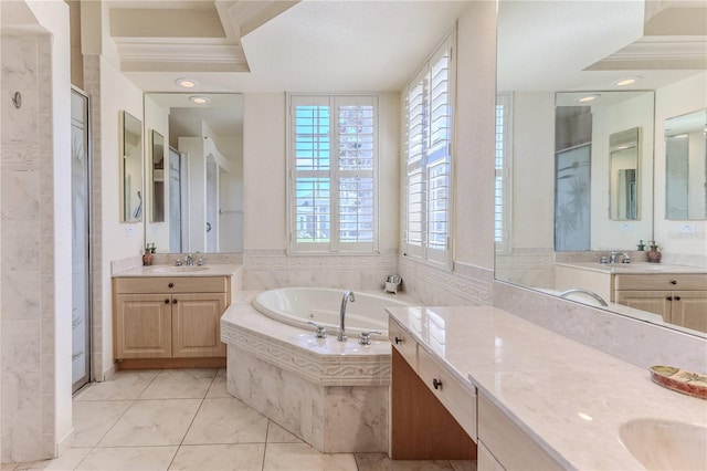 bathroom featuring plus walk in shower, tile patterned flooring, and vanity