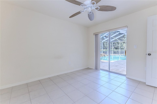 empty room with light tile patterned floors and ceiling fan