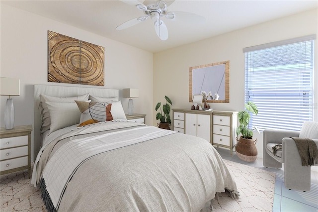 tiled bedroom featuring ceiling fan