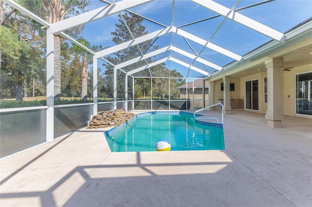 view of pool with a lanai and a patio area