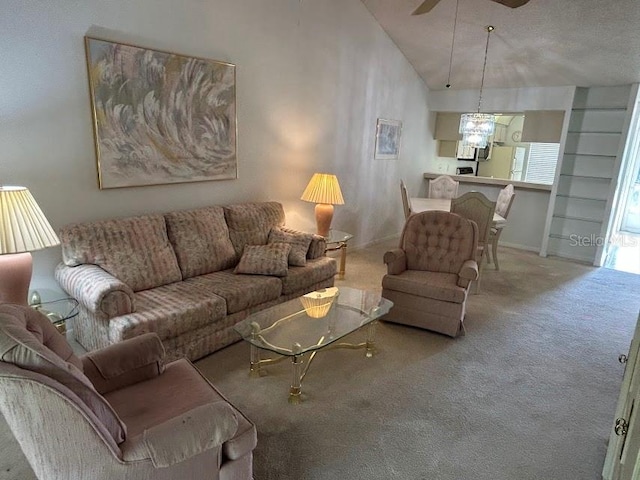 living room with carpet floors, high vaulted ceiling, and ceiling fan