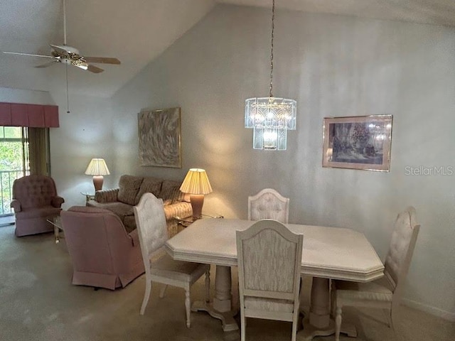 dining room with carpet floors, high vaulted ceiling, and ceiling fan