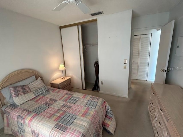 bedroom featuring ceiling fan and light carpet