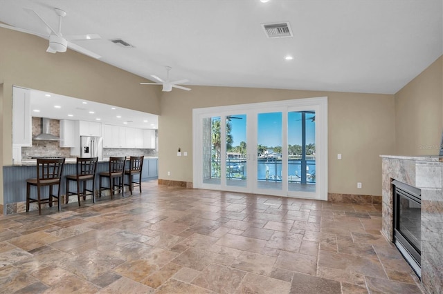 living room with vaulted ceiling and ceiling fan