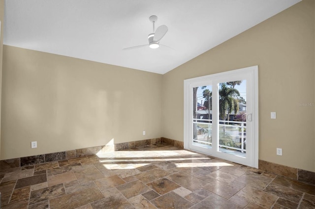 empty room featuring ceiling fan and lofted ceiling