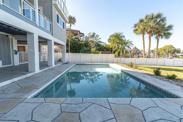 view of swimming pool with a patio