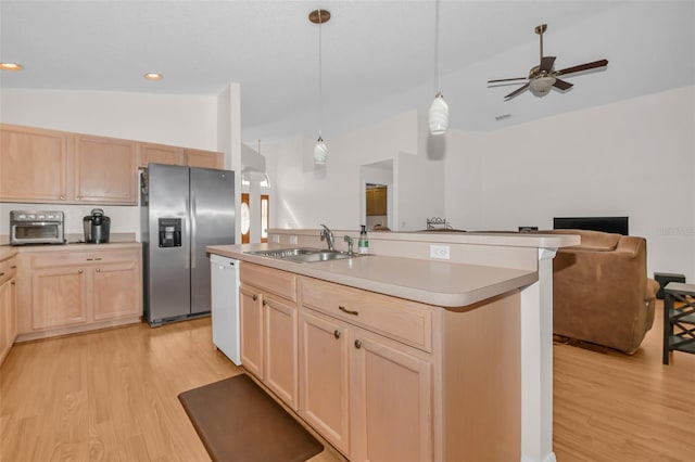 kitchen with light brown cabinets, light hardwood / wood-style flooring, vaulted ceiling, and stainless steel refrigerator with ice dispenser