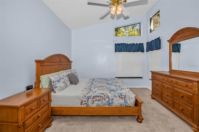 carpeted bedroom featuring ceiling fan and high vaulted ceiling