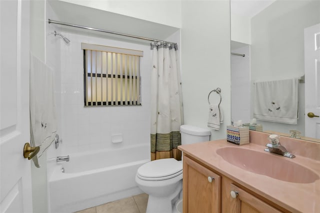 full bathroom with shower / bath combo with shower curtain, tile patterned flooring, vanity, and toilet