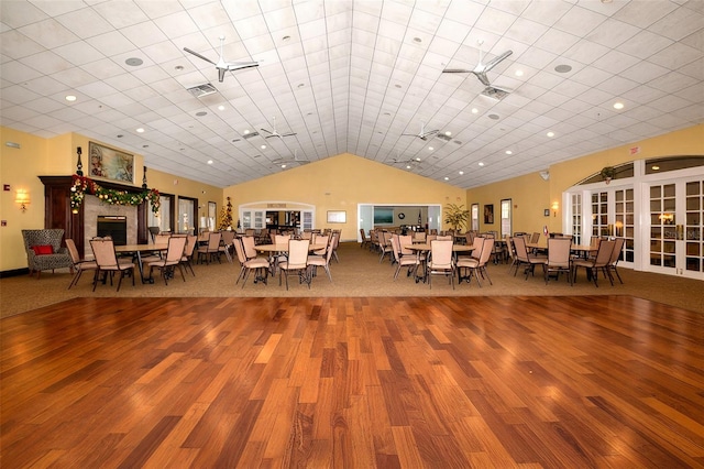 11445 Deercroft Ct, Spring Hill, FL 34609 - dining room with wood finished floors, lofted ceiling, and recessed lighting