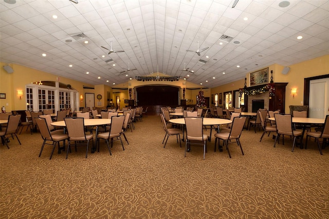 11445 Deercroft Ct, Spring Hill, FL 34609 - dining room featuring lofted ceiling, carpet flooring, and recessed lighting