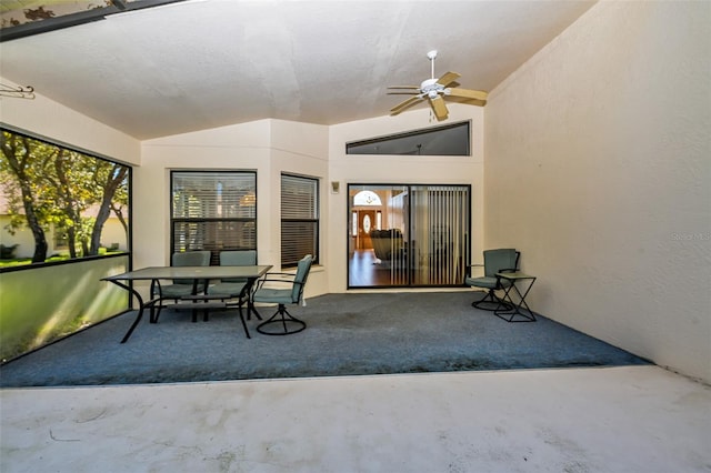 exterior space featuring ceiling fan and lofted ceiling