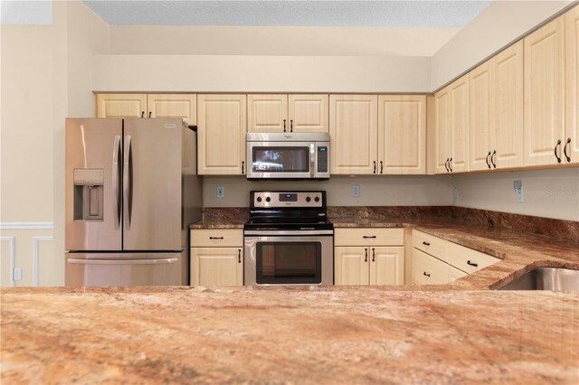 4201 Silver Berry Ct, Spring Hill, FL 34609 - kitchen featuring appliances with stainless steel finishes and light stone counters