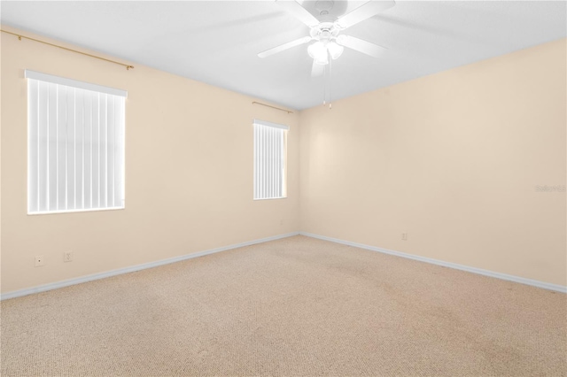 empty room with carpet and ceiling fan