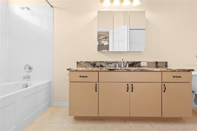 bathroom with vanity, shower / bath combination, and tile patterned floors