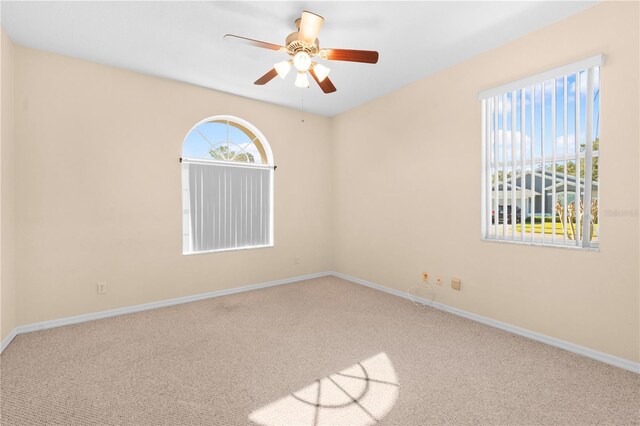 4201 Silver Berry Ct, Spring Hill, FL 34609 - empty room featuring carpet floors, a ceiling fan, and baseboards