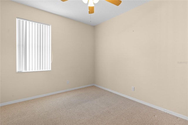 empty room with carpet floors and ceiling fan