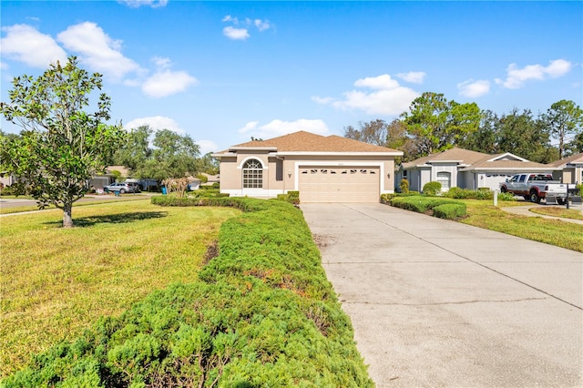 view of front of home featuring a front lawn and a garage