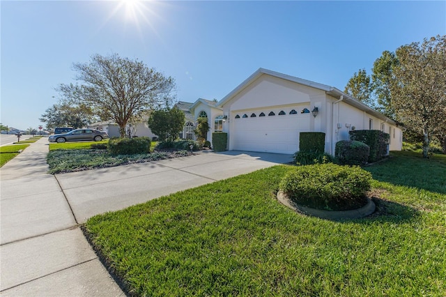 view of front facade featuring a front lawn and a garage