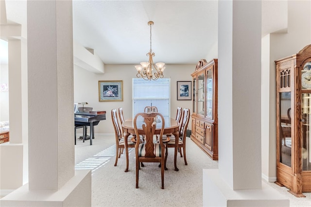 dining area featuring an inviting chandelier