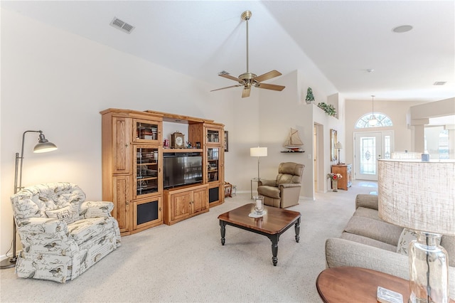 living room with ceiling fan, french doors, light carpet, and vaulted ceiling