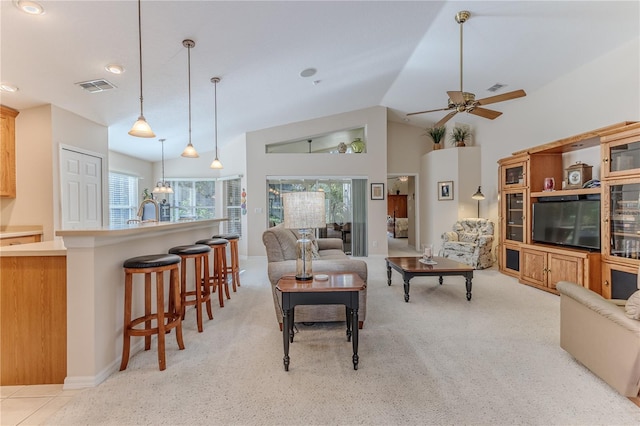 living room with light carpet, ceiling fan, and lofted ceiling