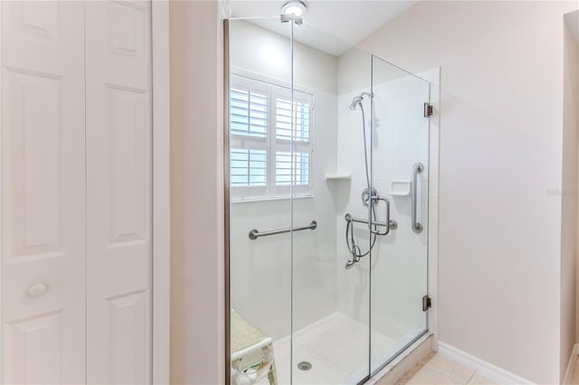 bathroom featuring tile patterned floors and walk in shower