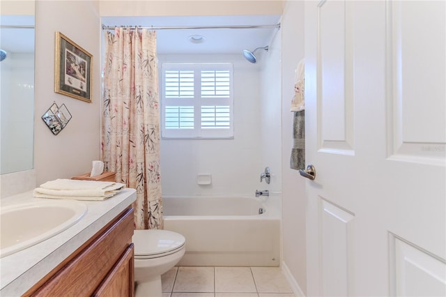 full bathroom featuring tile patterned floors, shower / bath combo with shower curtain, vanity, and toilet